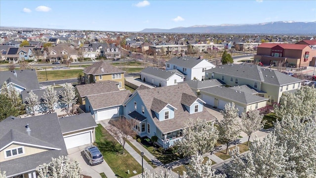 birds eye view of property with a residential view and a mountain view