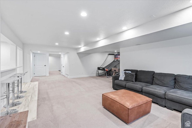 living area with light colored carpet, baseboards, and recessed lighting