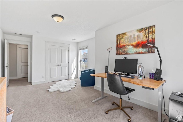 home office with baseboards and carpet floors