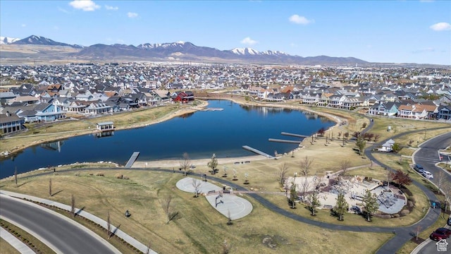 bird's eye view featuring a water and mountain view and a residential view