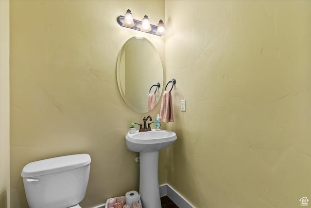 half bathroom with toilet