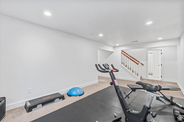 exercise room with carpet floors, baseboards, and recessed lighting
