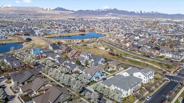 aerial view with a water and mountain view and a residential view