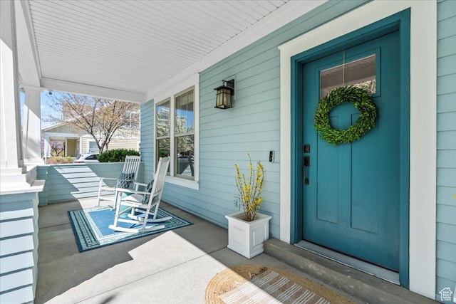 doorway to property featuring covered porch