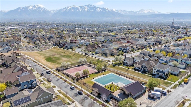 drone / aerial view featuring a residential view and a mountain view
