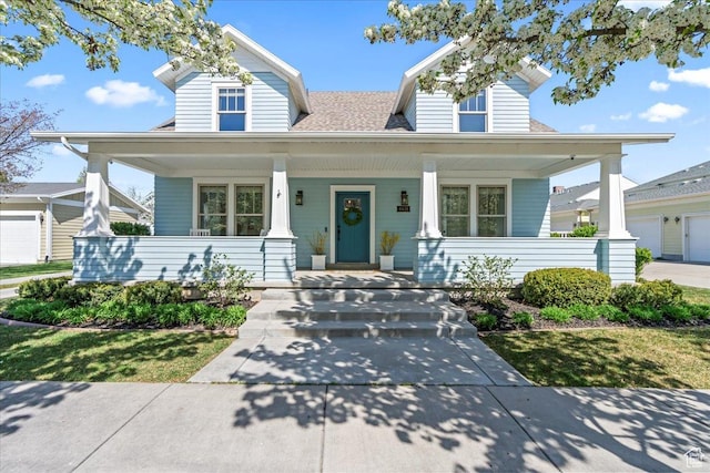 view of front of home with a porch and a shingled roof