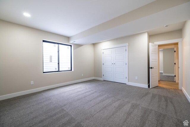 2899 E Lake Dr, Eagle Mountain, UT 84005 - unfurnished bedroom featuring a closet, carpet flooring, and baseboards