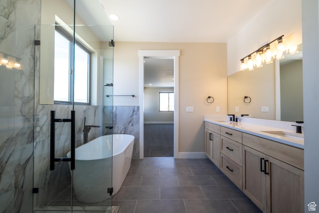 2899 E Lake Dr, Eagle Mountain, UT 84005 - bathroom with a sink, a soaking tub, double vanity, a marble finish shower, and tile patterned floors