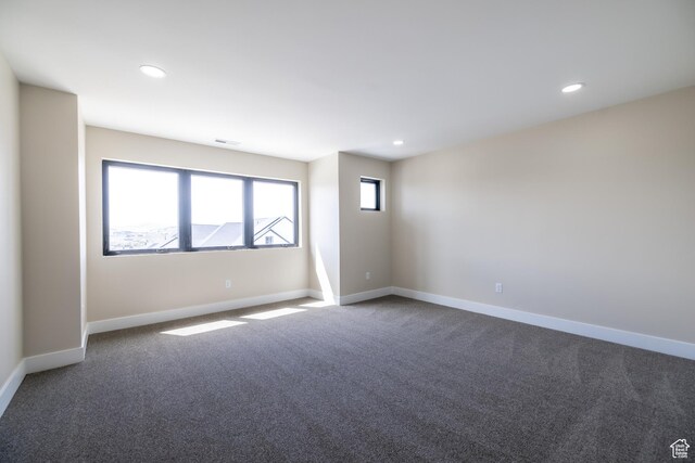 2899 E Lake Dr, Eagle Mountain, UT 84005 - unfurnished room with visible vents, dark colored carpet, and baseboards