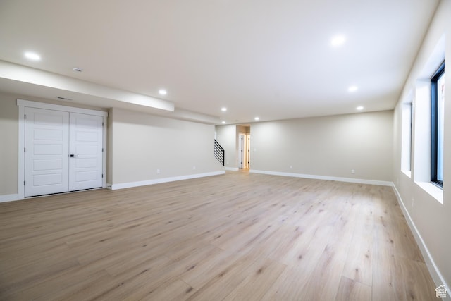 2899 E Lake Dr, Eagle Mountain, UT 84005 - basement featuring stairway, baseboards, light wood finished floors, and recessed lighting