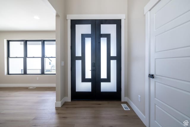 2899 E Lake Dr, Eagle Mountain, UT 84005 - foyer with wood finished floors, baseboards, visible vents, and recessed lighting