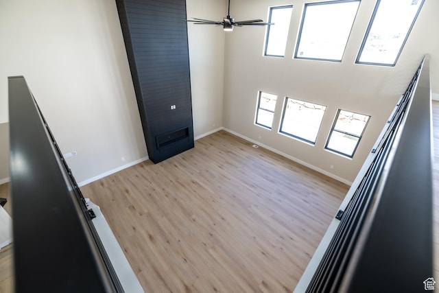 2899 E Lake Dr, Eagle Mountain, UT 84005 - spare room featuring light wood-style flooring, baseboards, and a ceiling fan