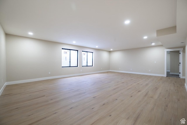 2899 E Lake Dr, Eagle Mountain, UT 84005 - empty room with recessed lighting, light wood finished floors, and baseboards
