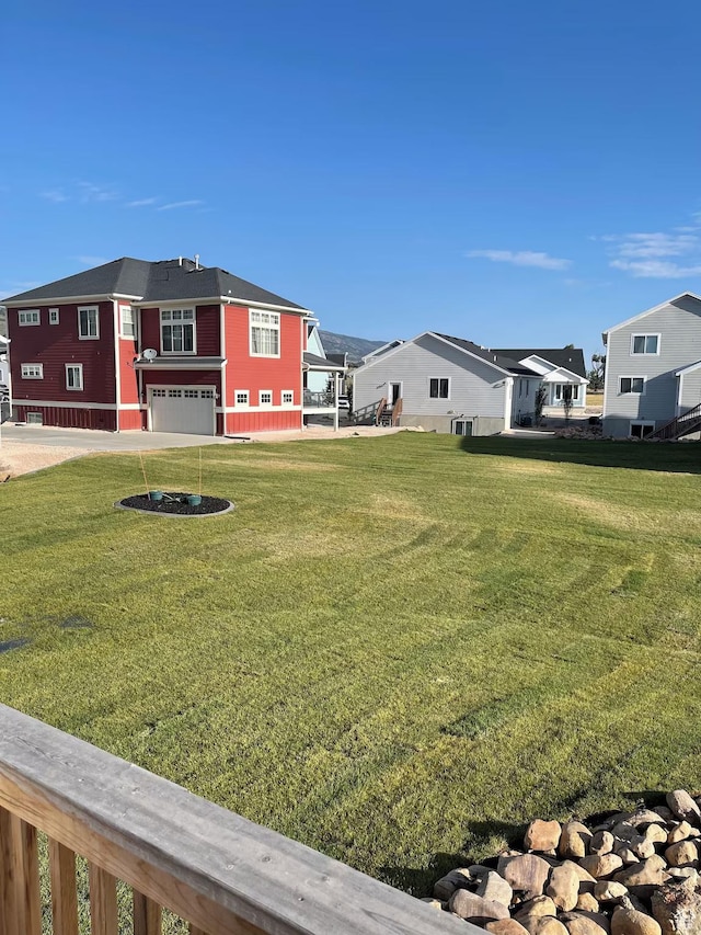 2250 S Beachcomber Ln, Garden City, UT 84028 - view of yard with a residential view and a garage