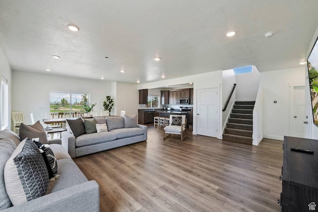 2250 S Beachcomber Ln, Garden City, UT 84028 - living area featuring recessed lighting, stairway, wood finished floors, and baseboards
