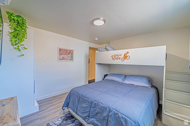 524 Westwood Ave, Moab, UT 84532 - bedroom with baseboards and light wood finished floors