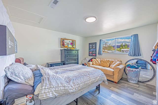 524 Westwood Ave, Moab, UT 84532 - bedroom with visible vents, attic access, and wood finished floors