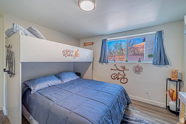 524 Westwood Ave, Moab, UT 84532 - bedroom with baseboards and wood finished floors