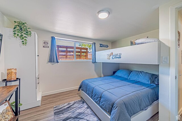 524 Westwood Ave, Moab, UT 84532 - bedroom featuring wood finished floors and baseboards