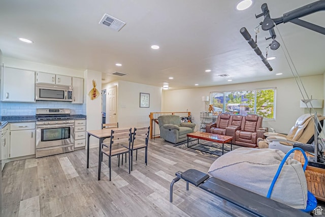 524 Westwood Ave, Moab, UT 84532 - living room with visible vents, recessed lighting, and light wood-style floors