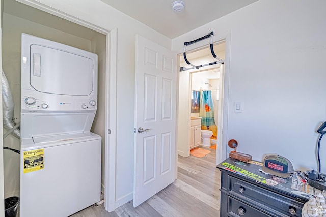 524 Westwood Ave, Moab, UT 84532 - laundry room featuring stacked washer / dryer, laundry area, and light wood finished floors