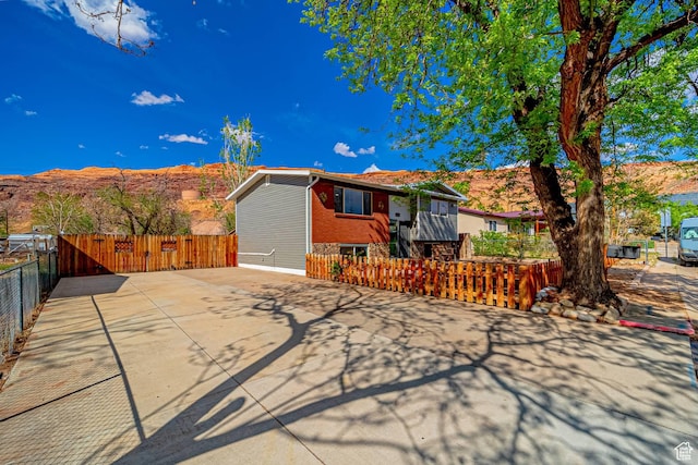 524 Westwood Ave, Moab, UT 84532 - view of front of house with brick siding and fence