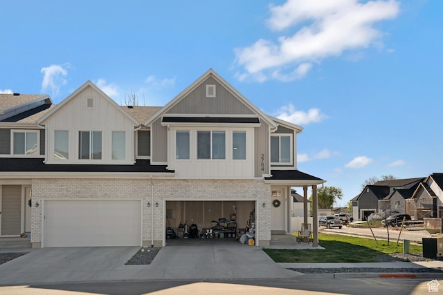 view of property with a garage, board and batten siding, and concrete driveway