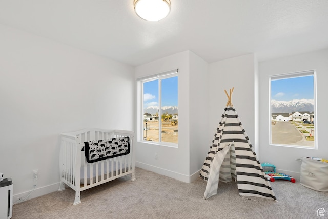 bedroom featuring baseboards and carpet floors