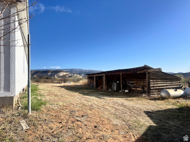 view of outbuilding featuring a mountain view and an outbuilding