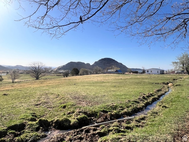 view of mountain background with rural landscape