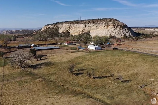 view of yard with a view of rural / pastoral area and a mountain view