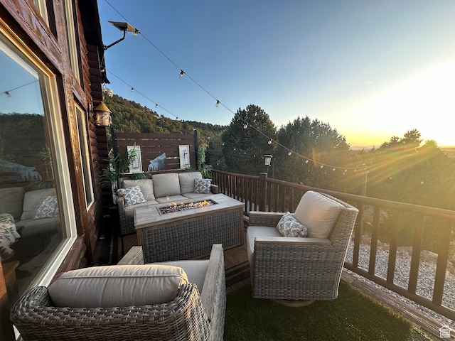 1741 S Red Canyon Dr, Parowan, UT 84761 - patio terrace at dusk with an outdoor living space with a fire pit