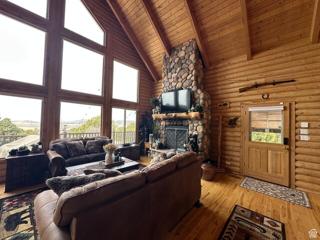 1741 S Red Canyon Dr, Parowan, UT 84761 - living area featuring high vaulted ceiling, a fireplace, wood ceiling, rustic walls, and beam ceiling