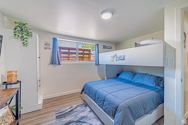 524 Westwood Ave, Moab, UT 84532 - bedroom featuring wood finished floors and baseboards