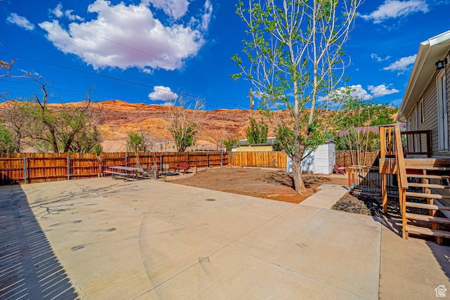 524 Westwood Ave, Moab, UT 84532 - fenced backyard with a patio and a deck with mountain view