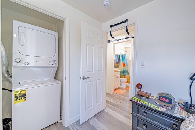 524 Westwood Ave, Moab, UT 84532 - washroom with estacked washer and dryer and light wood finished floors