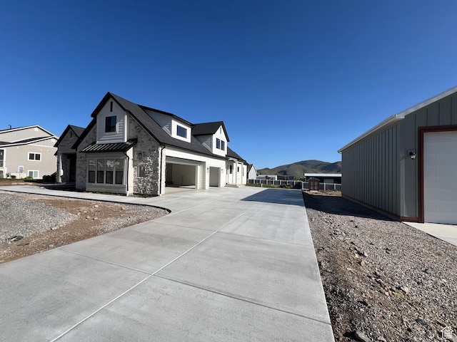 177 E 475 S, Mantua, UT 84324 - view of side of home featuring driveway, board and batten siding, a standing seam roof, a residential view, and metal roof