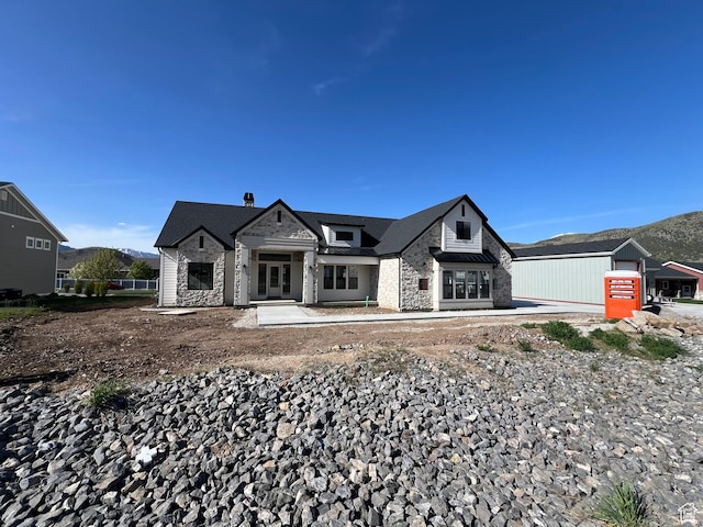 177 E 475 S, Mantua, UT 84324 - view of front of property featuring stone siding, french doors, a mountain view, and a chimney