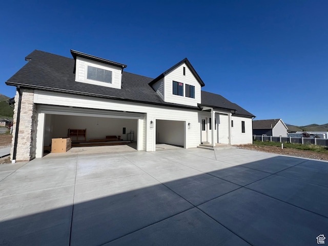 177 E 475 S, Mantua, UT 84324 - view of front of property featuring driveway, fence, roof with shingles, and an attached garage
