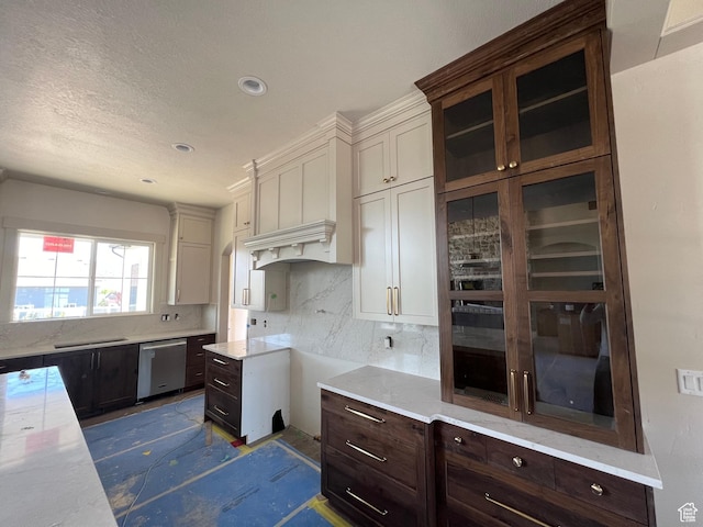 177 E 475 S, Mantua, UT 84324 - kitchen with stainless steel dishwasher, dark brown cabinets, decorative backsplash, white cabinets, and light countertops