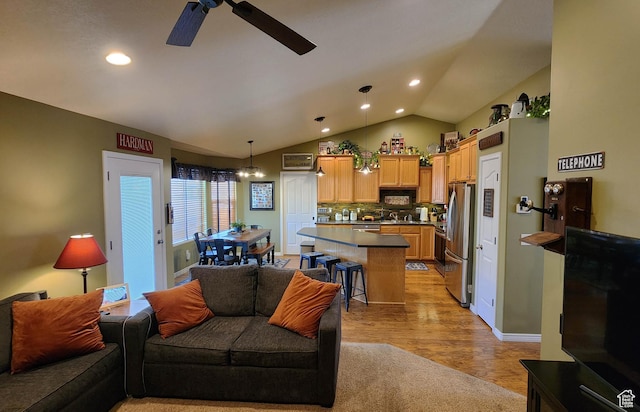 6723 W Hunter Farm Cir S, West Valley City, UT 84128 - living area with a ceiling fan, vaulted ceiling, recessed lighting, and light wood-style floors