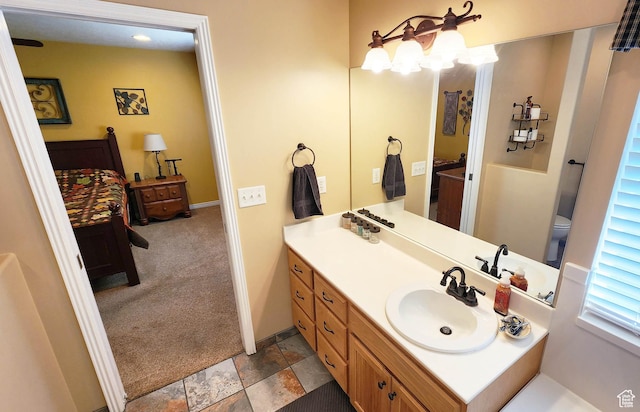 6723 W Hunter Farm Cir S, West Valley City, UT 84128 - bathroom with vanity, baseboards, and stone finish floors