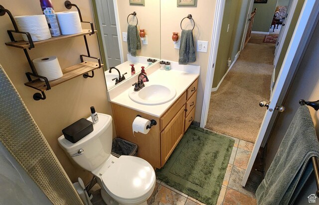 6723 W Hunter Farm Cir S, West Valley City, UT 84128 - bathroom with vanity, toilet, and baseboards