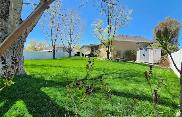6723 W Hunter Farm Cir S, West Valley City, UT 84128 - view of yard featuring a shed and an outbuilding