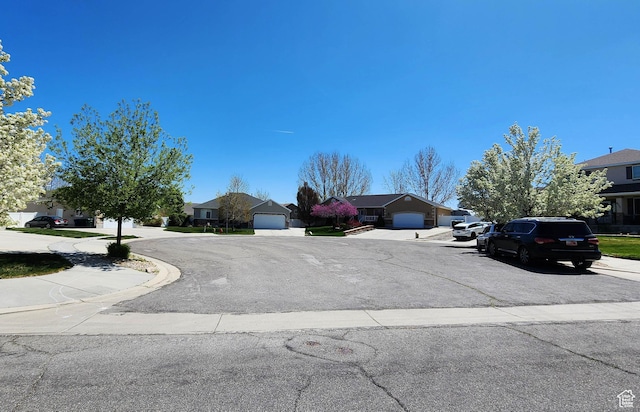 6723 W Hunter Farm Cir S, West Valley City, UT 84128 - view of asphalt road with a residential view, sidewalks, and curbs