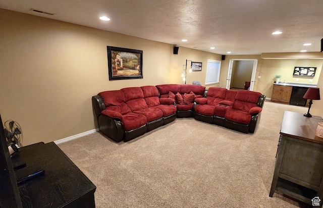 6723 W Hunter Farm Cir S, West Valley City, UT 84128 - living room featuring light carpet, recessed lighting, bar with sink, and baseboards