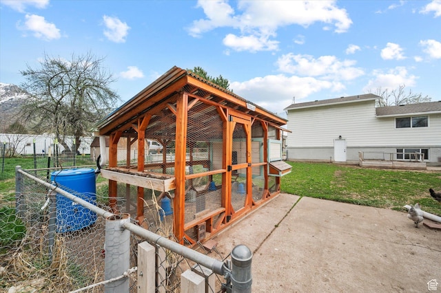 1308 Gilman Dr, Layton, UT 84040 - view of patio featuring fence, exterior structure, and an outdoor structure