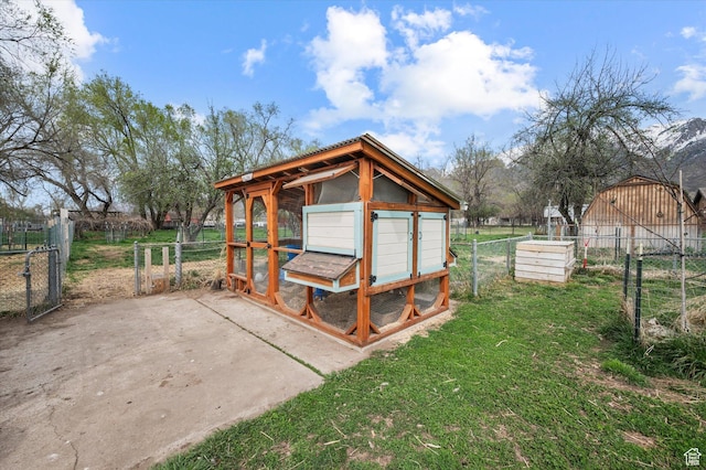 1308 Gilman Dr, Layton, UT 84040 - view of poultry coop featuring a lawn and fence