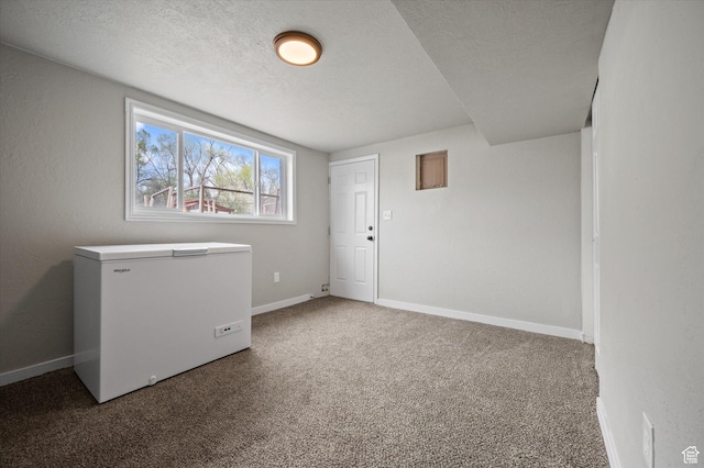 1308 Gilman Dr, Layton, UT 84040 - spare room with carpet floors, a textured ceiling, and baseboards