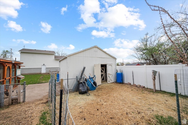 1308 Gilman Dr, Layton, UT 84040 - view of outbuilding with a fenced backyard and an outdoor structure